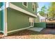 Back of home featuring a door to the basement, a patio, and a backyard at 5541 Downs Way, Lithonia, GA 30058