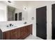 Bathroom featuring double vanity, framed mirrors, and modern fixtures at 5541 Downs Way, Lithonia, GA 30058