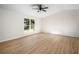 Bright bedroom featuring a large window and vaulted ceilings at 5541 Downs Way, Lithonia, GA 30058