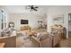 Spacious living room with vaulted ceiling, hardwood floors, and dining area at 5541 Downs Way, Lithonia, GA 30058