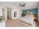 Well-appointed main bedroom with a custom wall design, natural light, and stylish decor at 5541 Downs Way, Lithonia, GA 30058