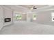 Spacious bedroom with a fireplace, neutral colors, carpet, and a ceiling fan for a relaxing ambiance at 3312 Steeple Chase Sw Way, Conyers, GA 30094