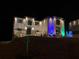 Festive two-story home adorned with colorful holiday lights and decorations at 3312 Steeple Chase Sw Way, Conyers, GA 30094