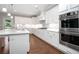 Modern kitchen with stainless steel appliances, white cabinets, and granite countertops at 3312 Steeple Chase Sw Way, Conyers, GA 30094