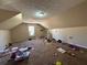 Spacious attic with neutral walls and carpeted floors, offering potential for storage and renovation at 430 N Oakland Cir, Mcdonough, GA 30253