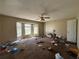 Bright bedroom featuring a bay window, ceiling fan, neutral walls, and carpeted floors, offering lots of natural light at 430 N Oakland Cir, Mcdonough, GA 30253