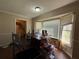 Bright dining room features a bay window and offers a cozy space for meals and relaxation at 430 N Oakland Cir, Mcdonough, GA 30253