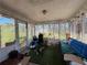 Enclosed porch with screened windows, blending indoor comfort with outdoor views at 430 N Oakland Cir, Mcdonough, GA 30253