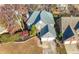 Aerial view of a two-story home with a two-car garage, manicured landscaping, and a gray shingled roof at 1920 Rosebriar Dr, Marietta, GA 30066