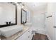 Modern bathroom featuring dual sinks, granite countertops, and decorative lighting at 1920 Rosebriar Dr, Marietta, GA 30066