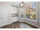 Charming breakfast nook with custom cabinets and large windows offering ample natural light at 1920 Rosebriar Dr, Marietta, GA 30066