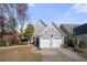 Charming two-story home featuring a well-manicured front yard, double garage, and classic architectural details at 1920 Rosebriar Dr, Marietta, GA 30066