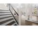 Hallway leading to the living area showing black banister and hardwood floors at 1920 Rosebriar Dr, Marietta, GA 30066