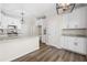 Bright kitchen featuring white cabinetry, granite countertops, stainless steel appliances, and hardwood floors at 1920 Rosebriar Dr, Marietta, GA 30066