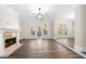 Spacious living room with tile fireplace, hardwood floors, large windows, and access to the outdoors at 1920 Rosebriar Dr, Marietta, GA 30066