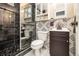 Elegant bathroom featuring a glass enclosed shower with modern fixtures and patterned tile at 300 W Peachtree St # 21K, Atlanta, GA 30305