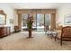 Inviting lounge area with comfortable seating, a round table, and a large window at 300 W Peachtree St # 21K, Atlanta, GA 30305