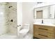 Bathroom boasts a tiled shower, modern fixtures, vanity, and framed mirror at 3119 Blue Heron Pass, Powder Springs, GA 30127