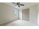 Carpeted bedroom with standard closet and a window that lets in natural light at 3119 Blue Heron Pass, Powder Springs, GA 30127