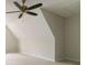 Spacious bonus room featuring a modern ceiling fan, neutral paint and plush carpeting at 3119 Blue Heron Pass, Powder Springs, GA 30127