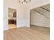 Dining area featuring hardwood floors, stairs, and a view into the kitchen at 3119 Blue Heron Pass, Powder Springs, GA 30127