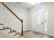 Bright foyer with hardwood floors, staircase and front door with sidelights at 3119 Blue Heron Pass, Powder Springs, GA 30127