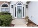 Close-up of the front door, highlighting the decorative glass and sidelights at 3119 Blue Heron Pass, Powder Springs, GA 30127