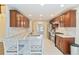 Spacious modern kitchen with stainless appliances, tile flooring, and a breakfast bar with seating at 3119 Blue Heron Pass, Powder Springs, GA 30127