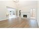 Open concept living room with fireplace, hardwood floors, and natural light at 3119 Blue Heron Pass, Powder Springs, GA 30127