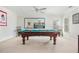 Basement game room with a pool table, neutral walls, ceiling fan, and natural light at 3718 Thunder Ne Way, Marietta, GA 30066