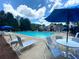 Relax by the sparkling community pool with comfortable lounge chairs, a great amenity for residents at 3718 Thunder Ne Way, Marietta, GA 30066