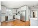 Modern kitchen featuring stainless steel appliances, a wine cooler and white cabinetry at 3718 Thunder Ne Way, Marietta, GA 30066