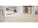 Bright, spacious basement with large white carpeted floor space, bedroom and full bathroom at 5320 Karr Rd, Cumming, GA 30040