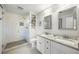 Modern bathroom with a glass-enclosed shower, dual sinks, and granite countertops at 5320 Karr Rd, Cumming, GA 30040