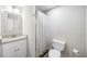 Bright bathroom featuring a granite vanity, and shower with a decorative shower curtain at 5320 Karr Rd, Cumming, GA 30040