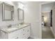 Bright bathroom with granite countertops, double sinks, framed mirrors and doorway to bedroom at 5320 Karr Rd, Cumming, GA 30040
