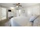 Bright bedroom with neutral tones, a view of the bathroom and a large closet at 5320 Karr Rd, Cumming, GA 30040