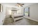 Calm bedroom with a decorative headboard bed, side tables, and natural light at 5320 Karr Rd, Cumming, GA 30040