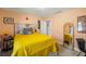 Bedroom with salmon-colored walls, white bedding with orange accents and a view of the backyard at 5320 Karr Rd, Cumming, GA 30040