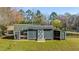 Well-kept chicken coop with an attached shed and fenced area, nestled in a large backyard at 5320 Karr Rd, Cumming, GA 30040