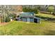 Large, well-maintained chicken coop in a sprawling green backyard with an additional outbuilding at 5320 Karr Rd, Cumming, GA 30040