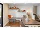 Inviting dining area features a built-in bench, rustic table, and charming decor on open shelving at 5320 Karr Rd, Cumming, GA 30040