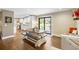 Open dining area flows into kitchen, showcasing a large table and access to outdoor patio at 5320 Karr Rd, Cumming, GA 30040
