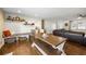 Cozy dining area with a custom bench, wood floors, and access to the living room at 5320 Karr Rd, Cumming, GA 30040