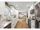 Spacious kitchen showcasing white cabinets, granite countertops, and stainless steel appliances at 5320 Karr Rd, Cumming, GA 30040