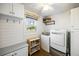 Charming laundry room with plenty of storage, natural light, and modern washer/dryer at 5320 Karr Rd, Cumming, GA 30040