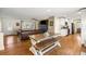 Bright and airy living room open to kitchen with wood floors and updated features at 5320 Karr Rd, Cumming, GA 30040