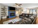 Open concept living room with a fireplace, wood floors, and sliding glass door at 5320 Karr Rd, Cumming, GA 30040