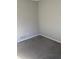 Neutral bedroom featuring an electrical outlet and carpeting at 5626 Pine Gate Dr, Atlanta, GA 30349