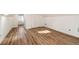 Finished attic space with wood-look flooring, white walls, and a closet at 1140 Goodwin Ne Pl, Atlanta, GA 30319